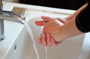 Washing hands frequently